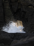 SX21436 Wave splashing though hole in rocks from Skrinkle haven to Church doors inlet.jpg